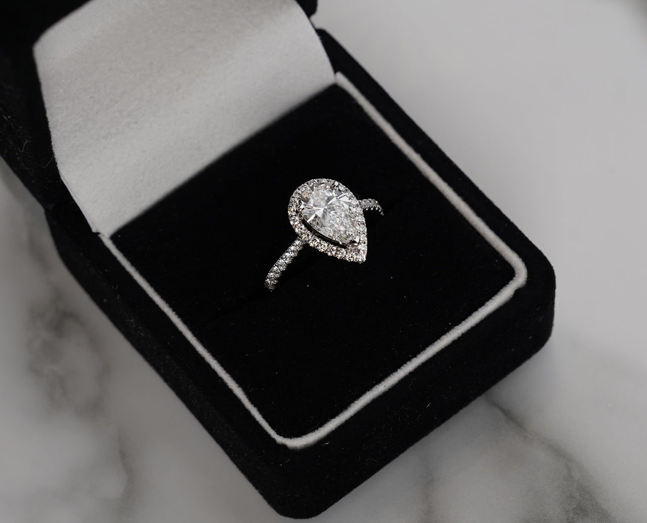 Pear Cut Diamond Classic Halo Engagement Ring in 18k White Gold