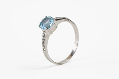 Round Blue Topaz with White Topaz Shoulder Accent in Sterling Silver Ring