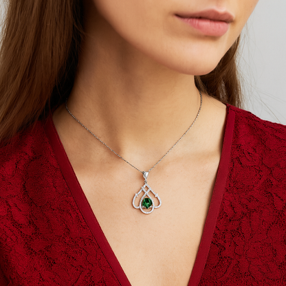 Teardrop Shaped White Gold Pendant With An Emerald