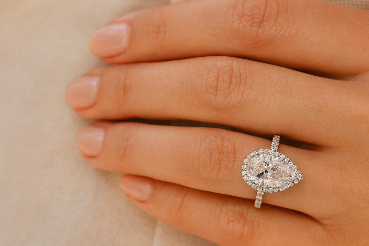 Pear Cut Diamond Classic Halo Engagement Ring in 18k White Gold