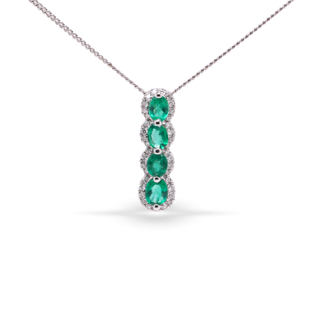 Elongated Vertical Oval Shaped Pendant With Emeralds