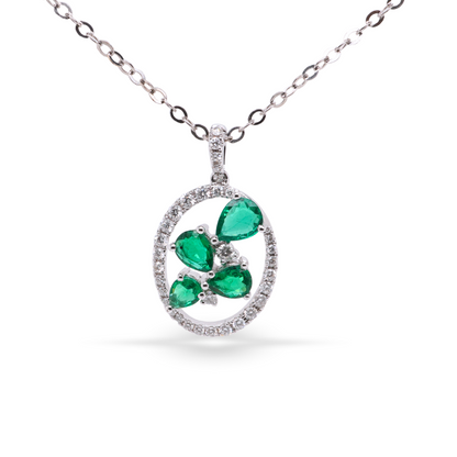 Oval Shaped White Gold Pendant with Emeralds