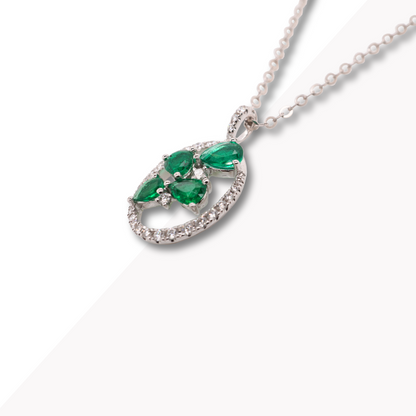 Oval Shaped White Gold Pendant with Emeralds